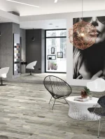 Salon sa belim stolicama i EXPONA Design podom u dezenu betona